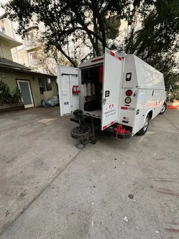 Magnet Plumbing service vehicle on-site for Grease Trap Cleaning in Oviedo